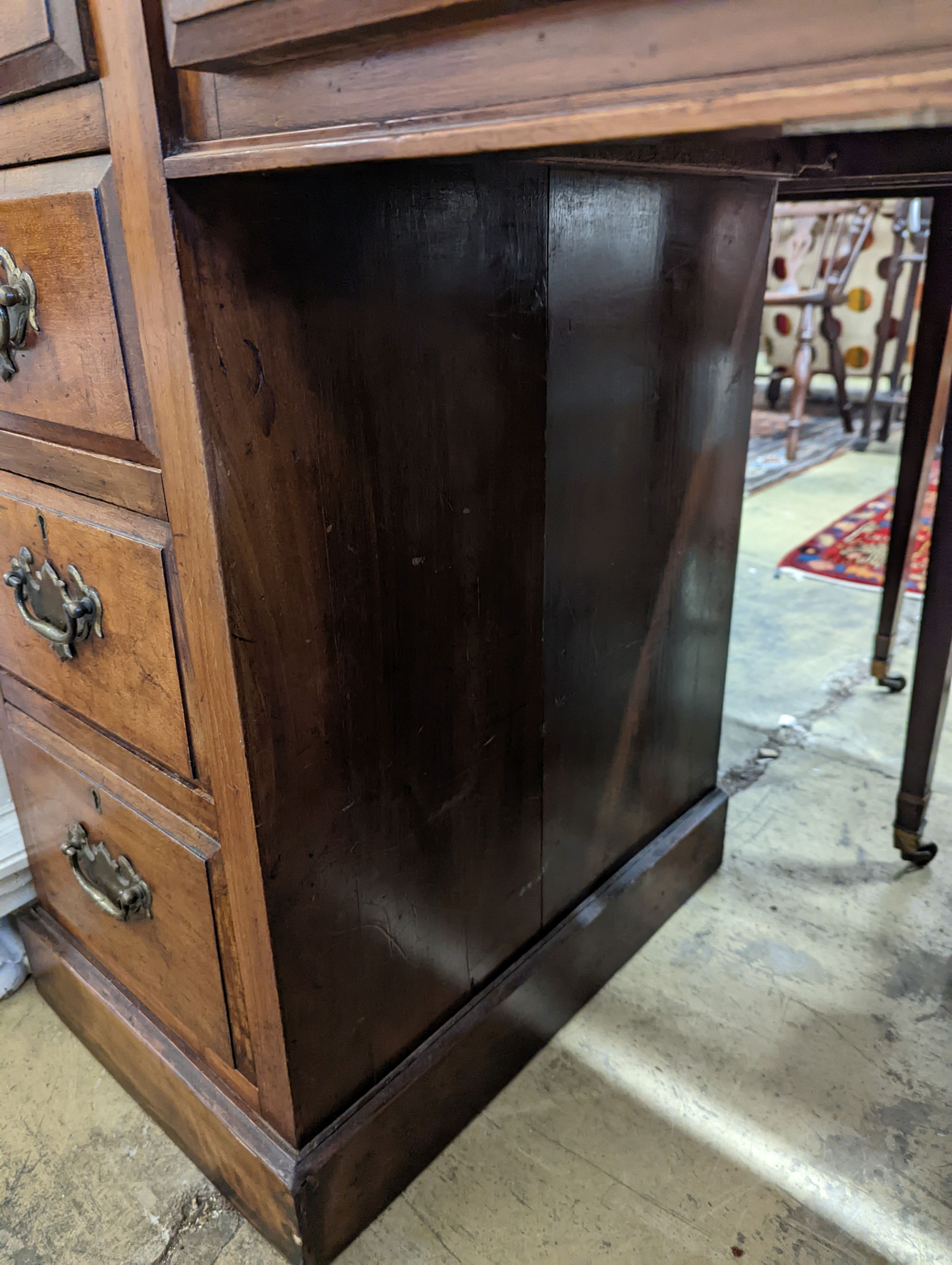 A late Victorian mahogany walnut kneehole desk, length 114cm, depth 55cm, height 78cm